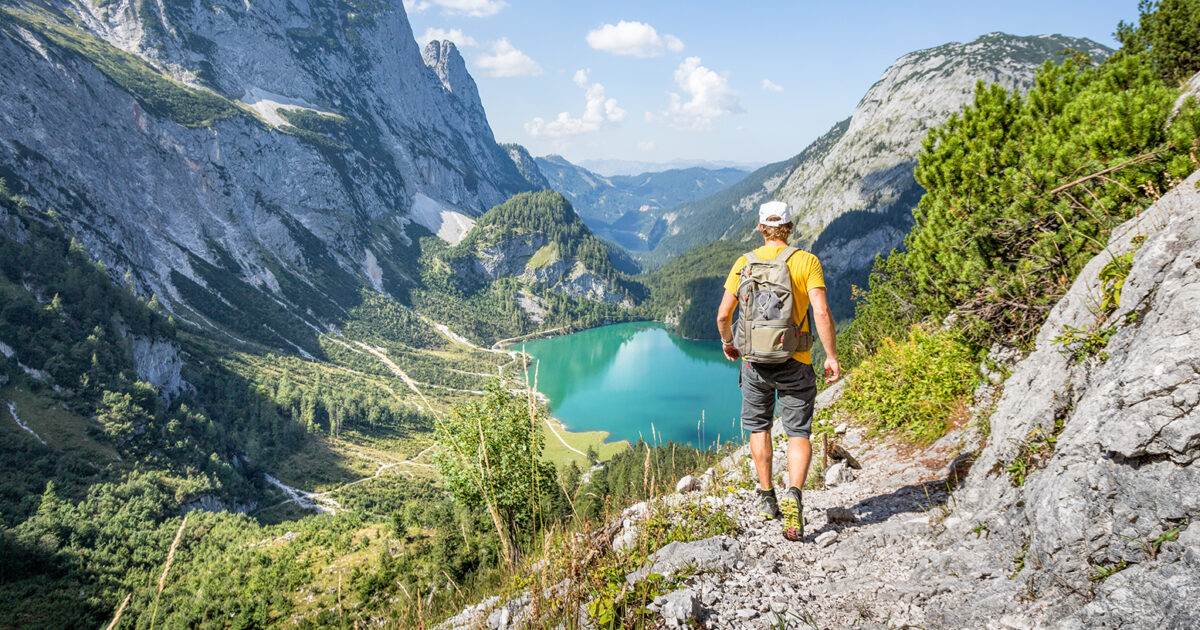 summer activities - person hiking in a wonderful scenery