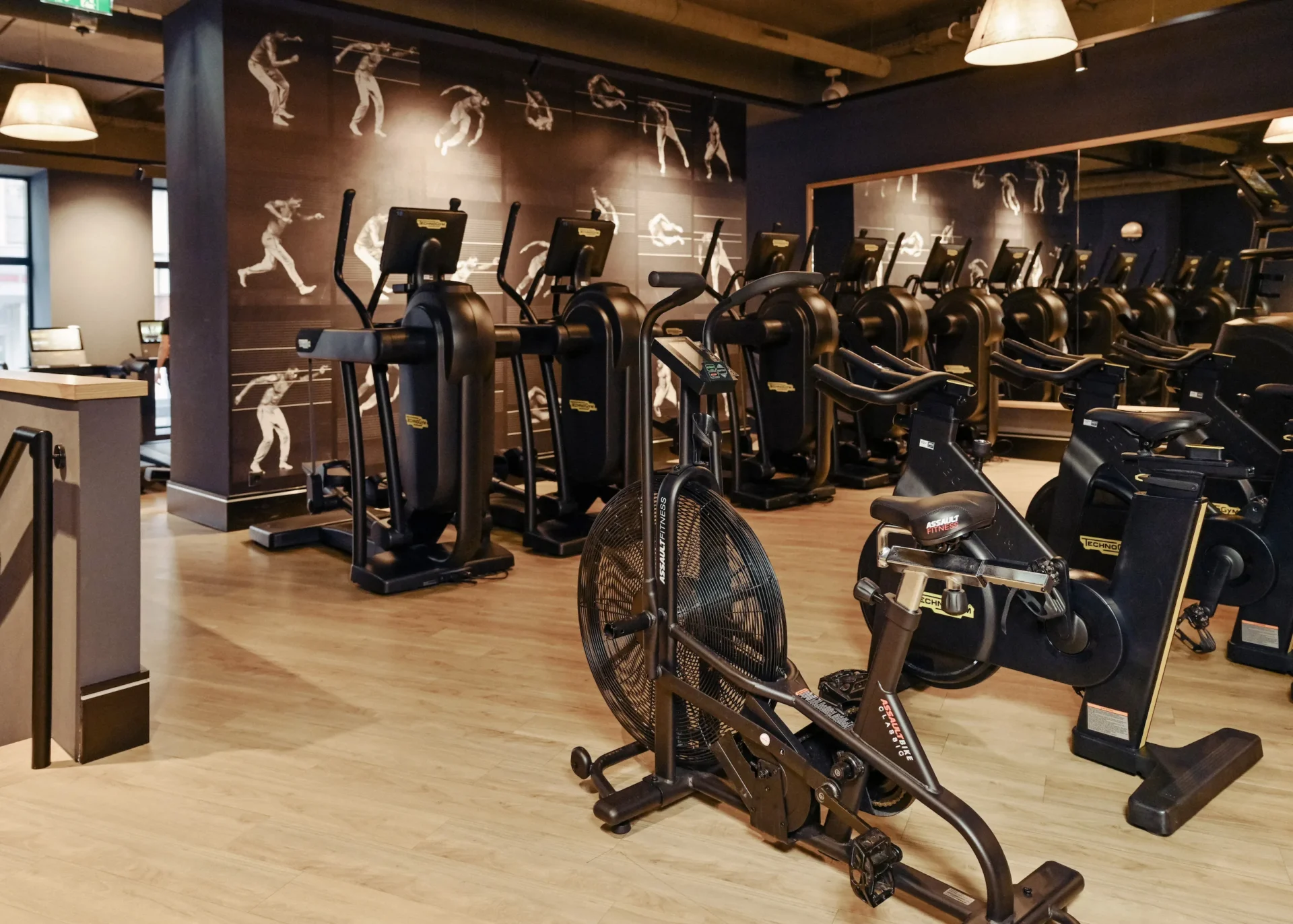 Cardio training zone with various Technogym machines at EVO Fitness