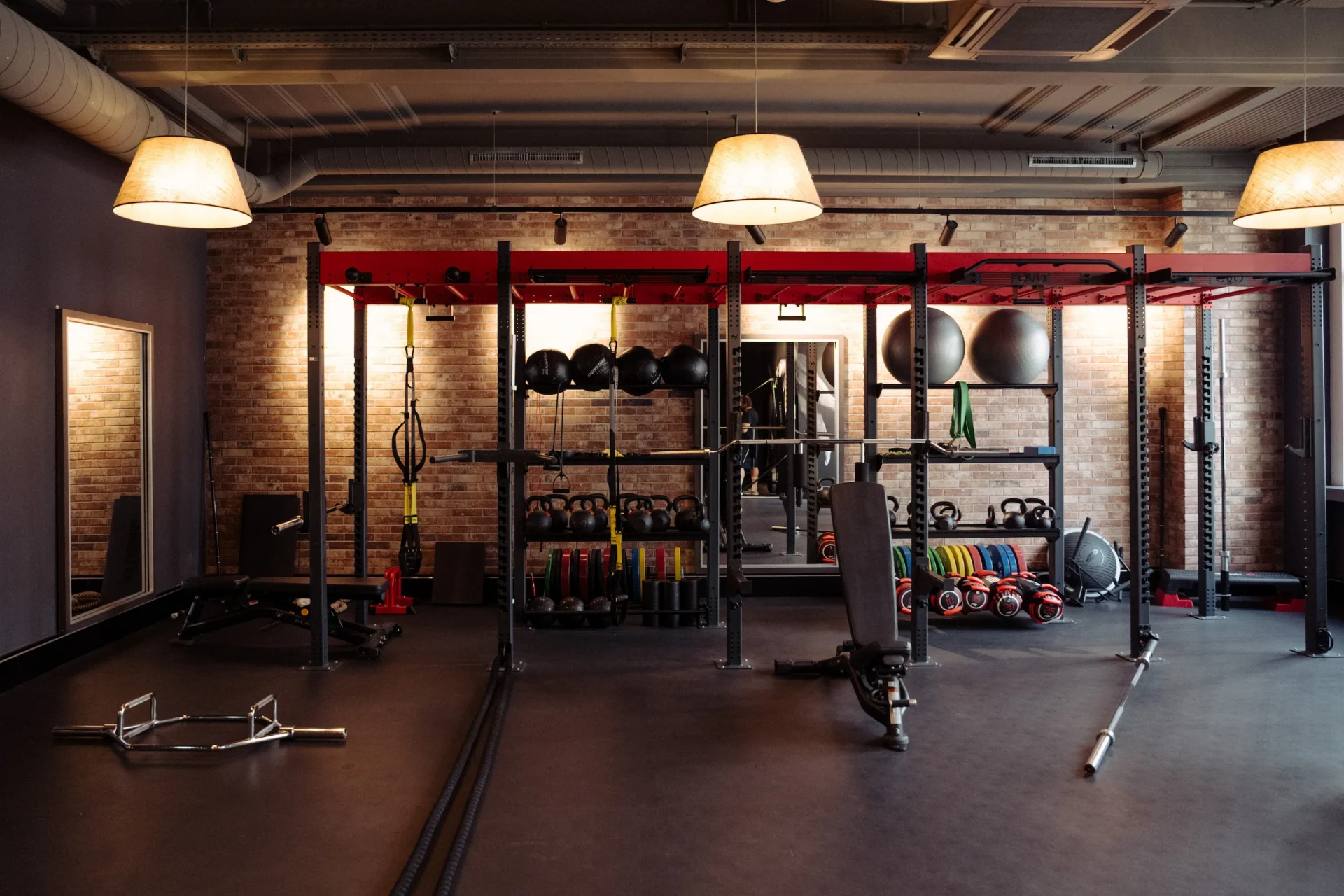 Strength training rig with weights and equipment at EVO Fitness