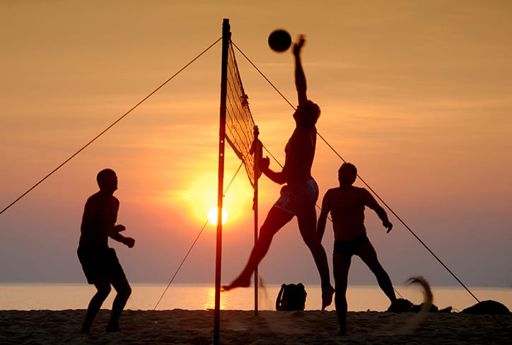 Playing volleyball on the beach