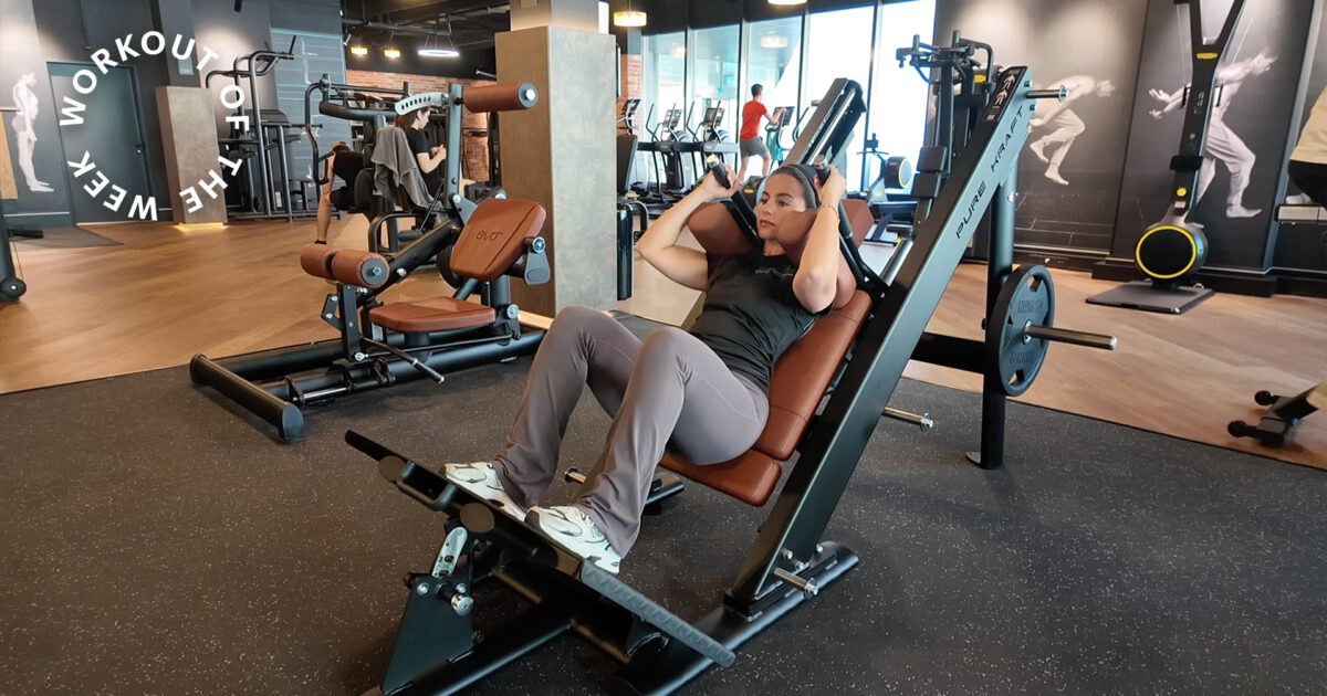 Workout of the week: 25-min quad strength workout - Woman using leg press machine in modern gym with cardio and strength equipment