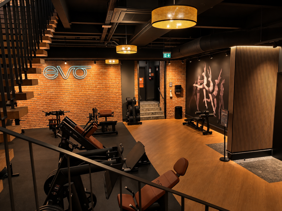 Modern strength training area with gym equipment and EVO branding at EVO Fitness Vienna Praterstrasse.